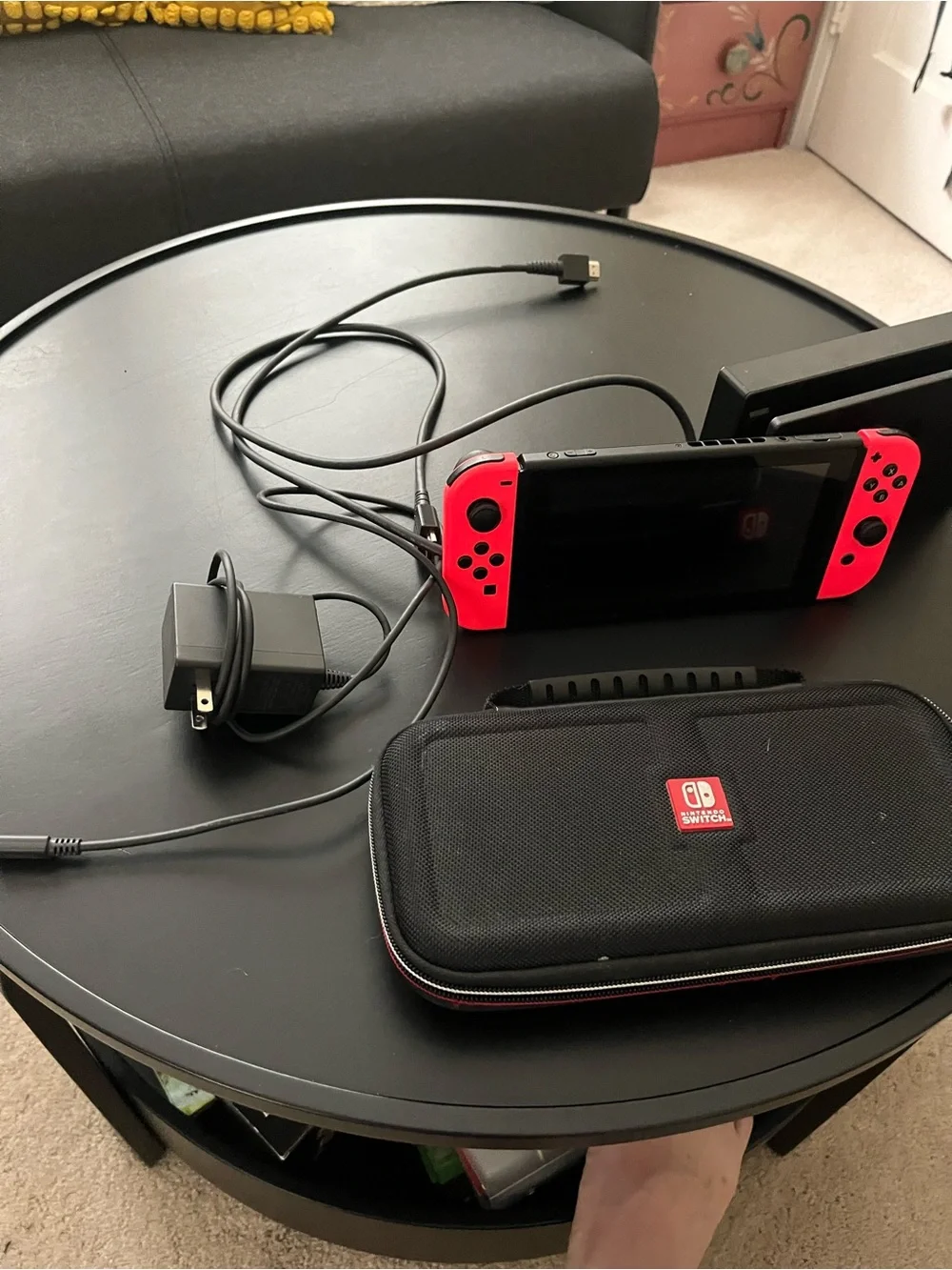 Nintendo Switch console with Neon Red and Neon Blue Joy-Con Controllers